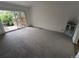 Spacious bedroom with large sliding door and plush carpeting at 8543 Redstone St, Highlands Ranch, CO 80126