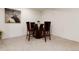 Dining area features dark wood chairs and table, perfect for enjoying meals in style at 8543 Redstone St, Highlands Ranch, CO 80126
