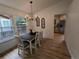 Bright dining room features hardwood floors and an open floor plan with great natural light at 8543 Redstone St, Highlands Ranch, CO 80126