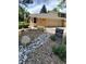 Charming home featuring a well-maintained front yard with mature trees and a two car garage at 8543 Redstone St, Highlands Ranch, CO 80126