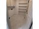 Laundry room with ample shelving and tiled floors for easy maintenance at 8543 Redstone St, Highlands Ranch, CO 80126