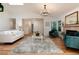 Open-concept living room with hardwood floors, fireplace, and modern furnishings creates a warm and inviting atmosphere at 8543 Redstone St, Highlands Ranch, CO 80126