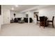 Cozy living room features a plush sofa, coffee table, and dining set, perfect for relaxing and entertaining at 8543 Redstone St, Highlands Ranch, CO 80126