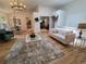 Bright living room features soaring ceilings, hardwood floors, and an open floor plan with great natural light at 8543 Redstone St, Highlands Ranch, CO 80126