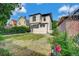 Charming two-story home with a well-maintained backyard and attractive landscaping at 2411 N High St, Denver, CO 80205