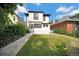 Charming two-story home with a well-maintained backyard and attractive landscaping at 2411 N High St, Denver, CO 80205