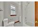 Updated bathroom with white subway tile, new fixtures, and natural light at 2411 N High St, Denver, CO 80205