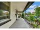 Spacious front porch with decorative ironwork and views of the street at 2411 N High St, Denver, CO 80205