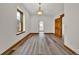 Spacious living room featuring a window, neutral walls, and modern light-colored flooring at 2411 N High St, Denver, CO 80205