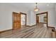 Open living room featuring hardwood floors, detailed trim, and natural light at 2411 N High St, Denver, CO 80205