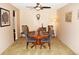 Cozy dining area featuring a round wood table with seating for four, neutral carpet and classic furnishings at 13661 E Marina Dr # 605, Aurora, CO 80014