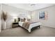 Bright bedroom features neutral paint, carpeted floors, and a large window at 930 Acoma St # 108, Denver, CO 80204