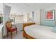 Lofted bedroom features a comfortable bed, bright art, and updated fixtures at 930 Acoma St # 108, Denver, CO 80204