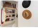 Organized closet with clothing, shoes, and hats, providing efficient storage and adding to a tidy home at 930 Acoma St # 108, Denver, CO 80204