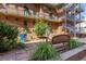 Community courtyard with seating, lush landscaping, and outdoor space at 930 Acoma St # 108, Denver, CO 80204