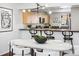Dining area adjacent to the kitchen with modern lighting and countertop seating at 930 Acoma St # 108, Denver, CO 80204