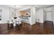 Modern dining area featuring a stylish chandelier and open access to the kitchen at 930 Acoma St # 108, Denver, CO 80204