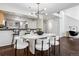 Bright dining room featuring a stylish light fixture and a modern white dining table with comfortable seating at 930 Acoma St # 108, Denver, CO 80204