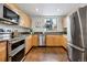 Well-equipped kitchen with stainless steel appliances and granite countertops at 930 Acoma St # 108, Denver, CO 80204