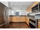 Modern kitchen featuring stainless appliances, granite countertops, and an open layout at 930 Acoma St # 108, Denver, CO 80204