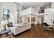 Inviting living room boasts hardwood floors, high ceilings, and an open loft space at 930 Acoma St # 108, Denver, CO 80204