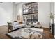 Bright living room boasts high ceilings, large windows, and stylish decor at 930 Acoma St # 108, Denver, CO 80204
