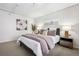 Comfortable main bedroom featuring a well-made bed, side tables, lamps, and neutral decor for relaxation at 930 Acoma St # 108, Denver, CO 80204