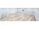 Finished basement featuring durable wood-look flooring and neutral paint at 14701 Yosemite St, Brighton, CO 80602