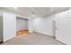 Finished basement with open floor plan, hardwood floors, and neutral paint at 14701 Yosemite St, Brighton, CO 80602