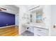 Bathroom featuring a vanity with a large mirror and a view into an adjoining bedroom at 14701 Yosemite St, Brighton, CO 80602