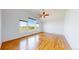 Airy bedroom featuring hardwood floors, large windows, and an open layout at 14701 Yosemite St, Brighton, CO 80602