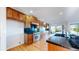 Spacious kitchen featuring wooden cabinetry, granite countertops, and high-end stainless steel appliances at 14701 Yosemite St, Brighton, CO 80602