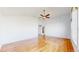 Spacious living room featuring hardwood floors and a ceiling fan for added comfort at 14701 Yosemite St, Brighton, CO 80602