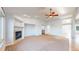 Inviting living room boasts a fireplace, recessed lights, and large windows at 14701 Yosemite St, Brighton, CO 80602