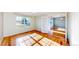Bright office with hardwood flooring, glass door, and abundant natural light at 14701 Yosemite St, Brighton, CO 80602