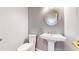 Powder room featuring a pedestal sink, oval mirror and modern lighting at 14701 Yosemite St, Brighton, CO 80602