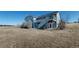 The back of the home shows a two-story deck and lower patio area at 14701 Yosemite St, Brighton, CO 80602