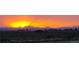 Scenic sunset view with vibrant orange skies over distant mountains and a dark foreground at 14701 Yosemite St, Brighton, CO 80602
