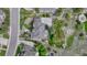 Aerial view of a home with a patio, lush greenery, and a well-maintained roof at 5428 Forest View Rd, Parker, CO 80134