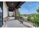 Balcony with stone pillars and an iron railing, offering neighborhood views at 5428 Forest View Rd, Parker, CO 80134