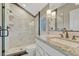 Bathroom featuring a step-in shower, granite countertops, and white cabinets at 5428 Forest View Rd, Parker, CO 80134