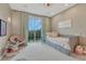 Bedroom featuring a single bed, carpeted flooring, and large glass sliding doors to balcony at 5428 Forest View Rd, Parker, CO 80134