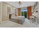 Bedroom featuring a large single bed, carpeted flooring, a work desk and large balcony doors at 5428 Forest View Rd, Parker, CO 80134