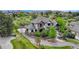 Aerial view of home showcasing its manicured lawn, stone accents, and well-designed landscaping at 5428 Forest View Rd, Parker, CO 80134