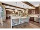 Gourmet kitchen with granite countertops, stainless steel appliances, and a large center island with seating at 5428 Forest View Rd, Parker, CO 80134