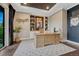 Home office with custom built-ins, a large desk, and a neutral color palette, offering a professional workspace at 5428 Forest View Rd, Parker, CO 80134