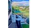 Elevated backyard view with patio, shade, nice landscaping, and beautiful scenery at 8172 S Langdale Way, Aurora, CO 80016