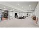 Spacious basement provides ample room for living, entertainment, and relaxation with a sliding barn door at 8172 S Langdale Way, Aurora, CO 80016