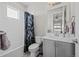 Bright, clean bathroom with a tub/shower combination, modern vanity, and neutral color palette at 8172 S Langdale Way, Aurora, CO 80016