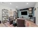 Entertainment room with comfortable seating and display shelves, perfect for showcasing collectibles at 8172 S Langdale Way, Aurora, CO 80016